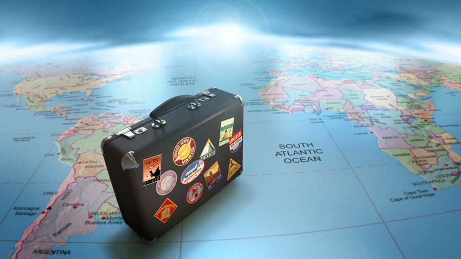 Suitcase on a world map